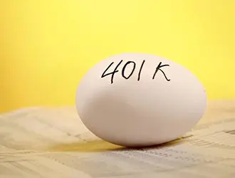 A white egg with the word " 4 0 1 k " written on it.